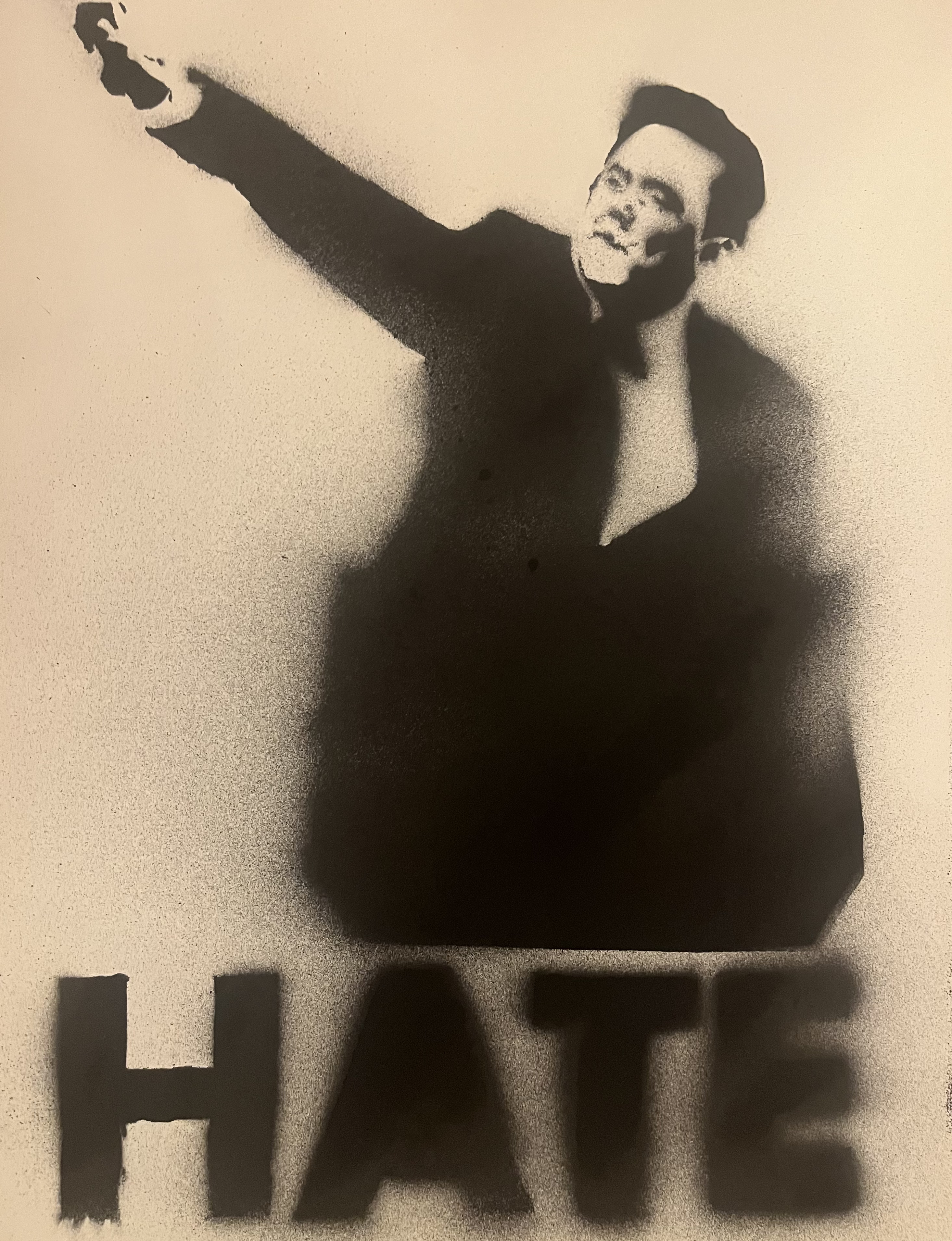 an image of a stencil silhouette created with spray paint on paper that depicts elon musk giving a nazi salute